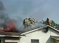 Fighting a house fire on the roof